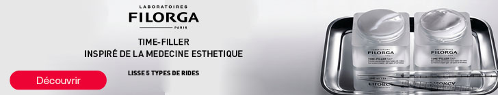 Bannière FILORGA Paris. À gauche, les textes « TIME-FILLER », « INSPIRÉ DE LA MEDECINE ESTHETIQUE » et « LISSE 5 TYPES DE RIDES » sont affichés au-dessus d’un bouton rouge « Découvrir ». À droite, deux pots de crème TIME-FILLER sont posés sur un plateau métallique avec une seringue placée devant les produits.