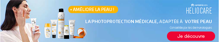 Bannière bleu clair avec à gauche une femme appliquant une crème solaire. Au centre plusieurs produits solaires Heliocare. En haut apparaît « + Améliore la peau ! » et à droite « La photoprotection médicale, adaptée à votre peau - Conseillée par les dermatologues ». En haut à droite, le logo Cantabria Labs Heliocare et en bas à droite un bouton rouge « Je découvre ».