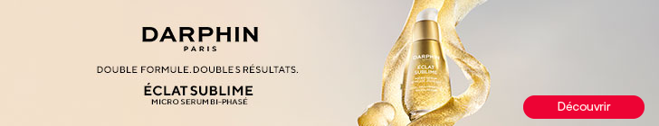 Bannière beige avec le logo « Darphin Paris ». Le texte indique « Double formule, doubles résultats. » puis « Éclat Sublime Micro Serum bi-phase ». À droite, un flacon doré entouré de rubans de liquide doré en mouvement.